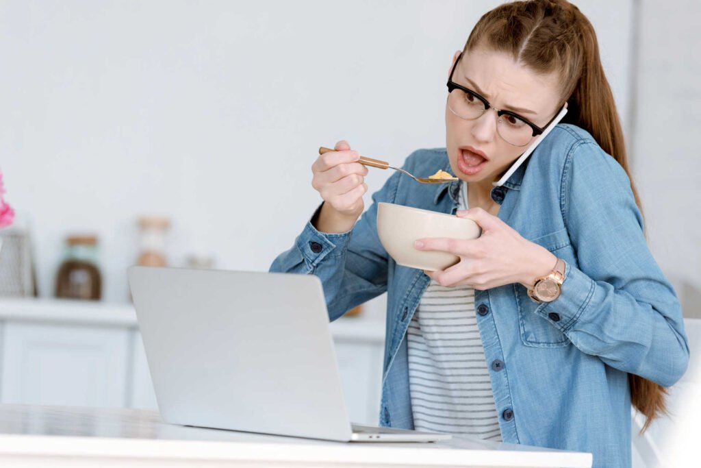 a woman holding a bowl and a phone to her ear while discussing google's helpful content update